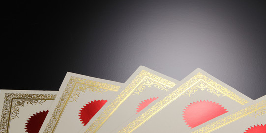 Awards A couple of deeds lying on top of each other.